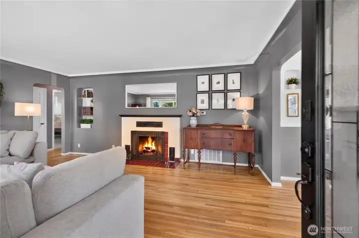 Original wood floors and a working wood burning fireplace.