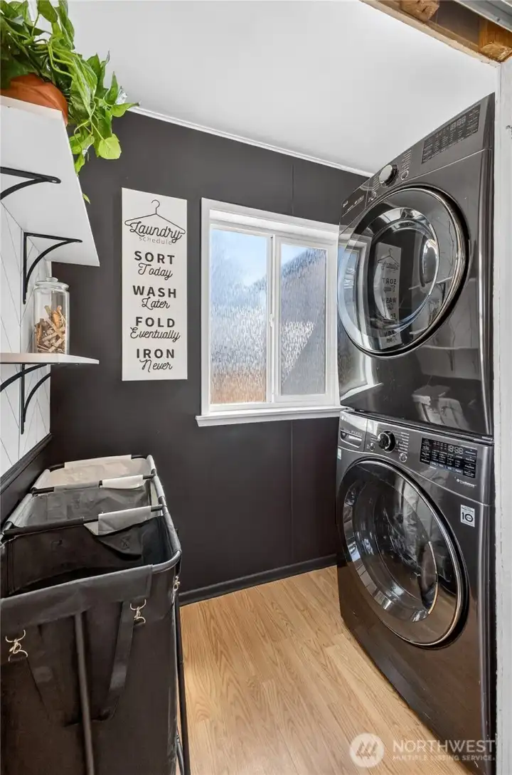 Laundry: Designated laundry space. This is located to the right of the back door, opposite the office area.