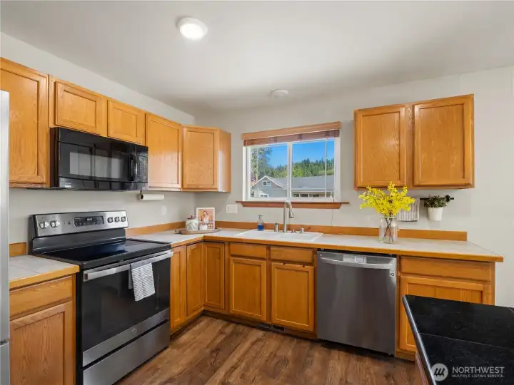 kitchen offers abundant cabinet storage, generous counter space, and a functional layout perfect for everyday living. kitchen offers abundant cabinet storage, generous counter space, and a functional layout perfect for everyday living.