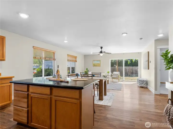The kitchen flows seamlessly into the dining and living areas, creating a bright, open-concept layout that's perfect for everyday living. The kitchen flows seamlessly into the dining and living areas, creating a bright, open-concept layout that's perfect for everyday living.