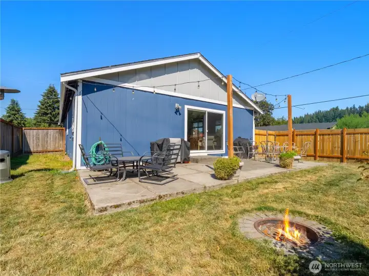 The backyard is perfect for entertaining, featuring an expanded patio and inviting fire pit area designed for relaxing, gathering, and making memories outdoors. The backyard is perfect for entertaining, featuring an expanded patio and inviting fire pit area designed for relaxing, gathering, and making memories outdoors.