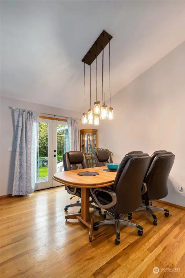 Light and bright dining room area with vaulted ceilings and
