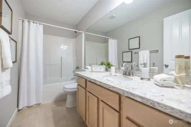 Across from the bedrooms is this nicely-appointed hall bathroom.