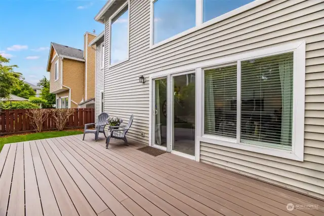 From the living room, head out back to this incredible back deck!
