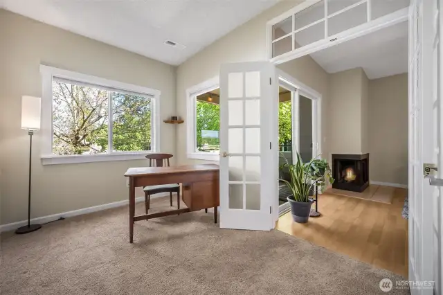 Natural light fills this room and the transom window above the French door gives character