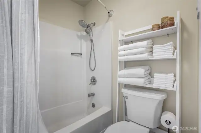Full size tub/shower and toilet separate from the rest of the bathroom