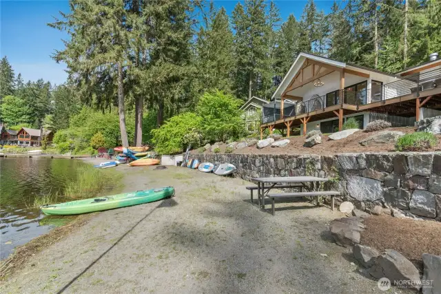 The sandy beach is perfect for launching paddle boards or kayaks.