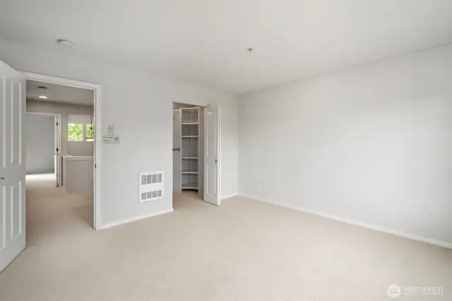 Bright hallway connecting bedrooms as seen from the master suite