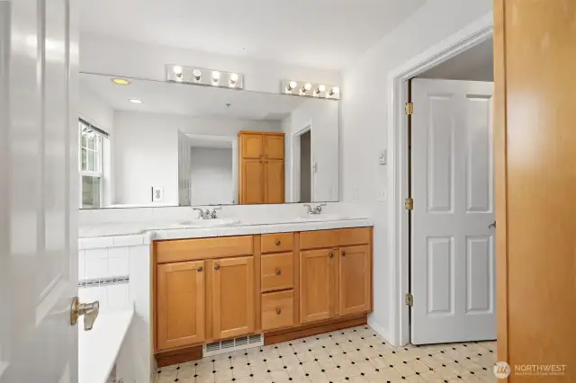 Bright master bath with double vanity and ample storage