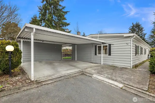 Side by side parking! No shuffling of cars. Also, access to the backyard from the carport.