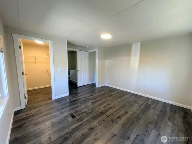 Primary bedroom with walk-in closet