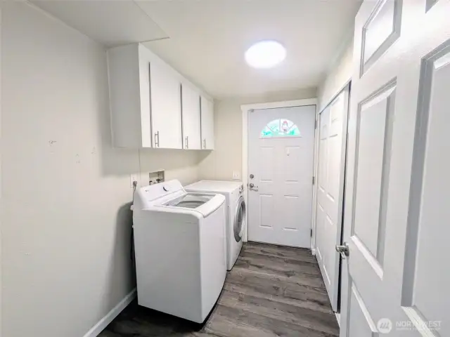 Large laundry room with cabinets and a closet as well as room for shelving or ?