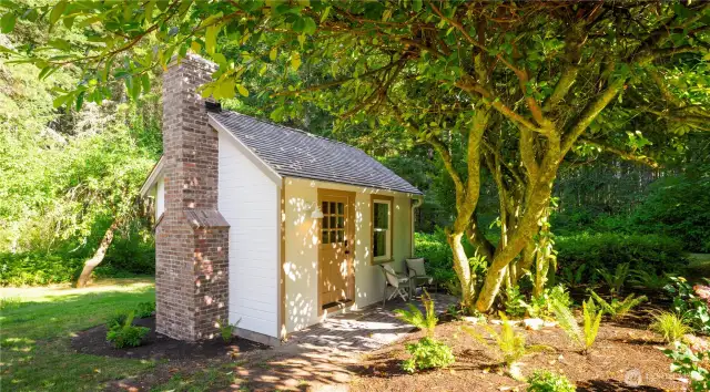 The sleeping cabin is a perfect retreat with a cedar roof.