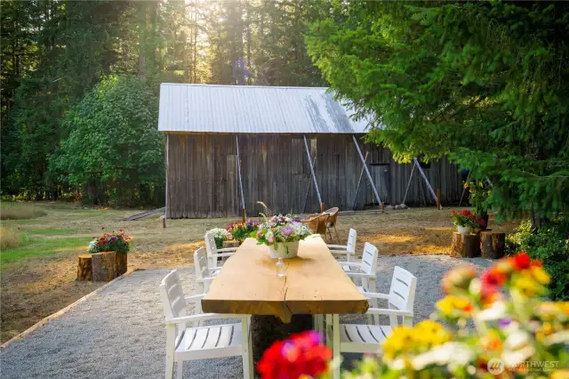 The outdoor dining space looking toward the historical barn.