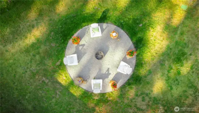 Aerial of the fire pit. The perfect space to gather on warm summer evenings in the stunning Pacific Northwest.