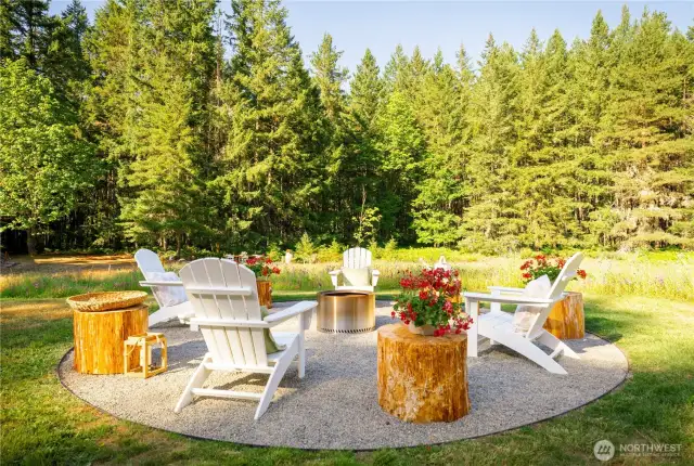The fire pit with the meadow beyond.