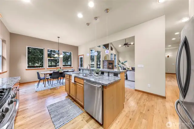 Open floor plan with large kitchen having stainless steel appliances