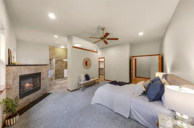 Fireplace in the primary bedroom, separate shower and jetted tub.