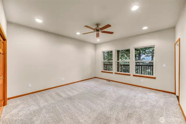 Third bedroom on the second level with a private door out to the second deck.