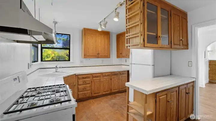 Clean and functional kitchen with plenty of cabinet and countertop space.