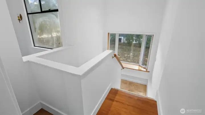 Staircase that leads to 2 bedrooms and utility room.