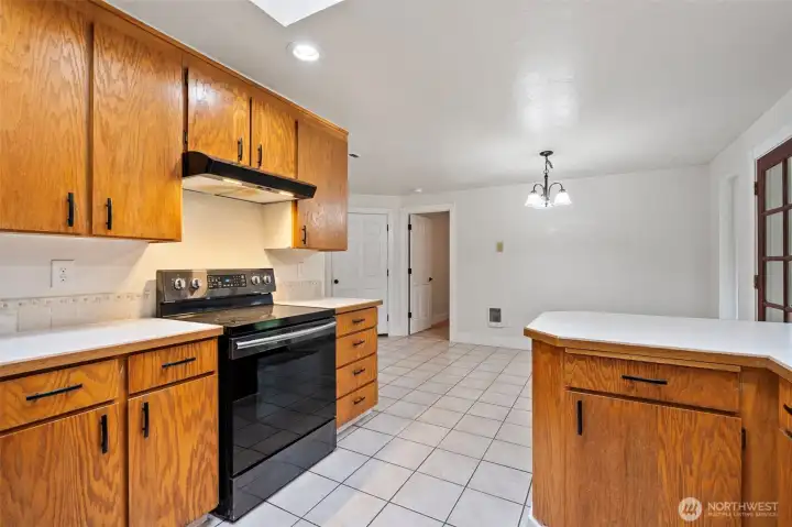 Access to garage is through the left door. The right door leads to the primary suite, separate from guest bedrooms.