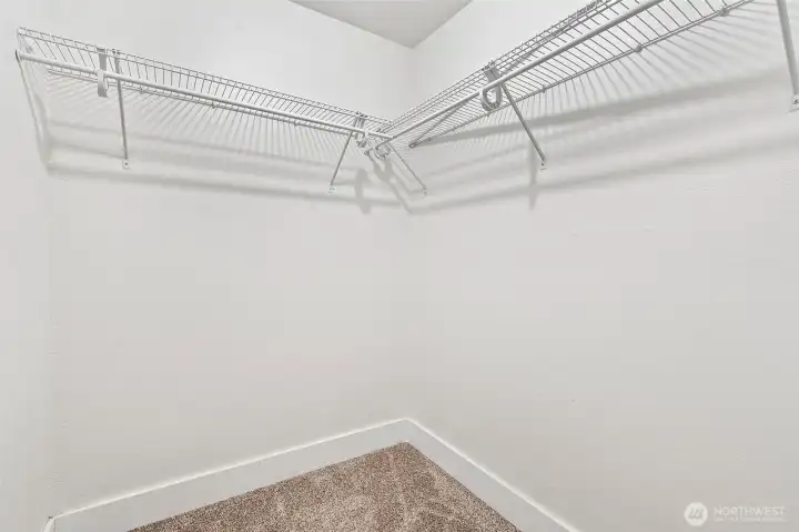 Walk-in primary closet.