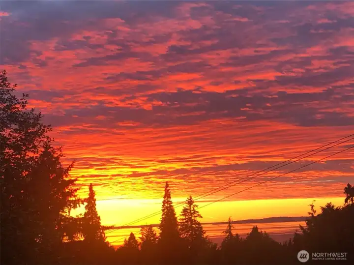 Enjoy Dramatic Sunsets over Puget Sound from this stunning Edmonds home.