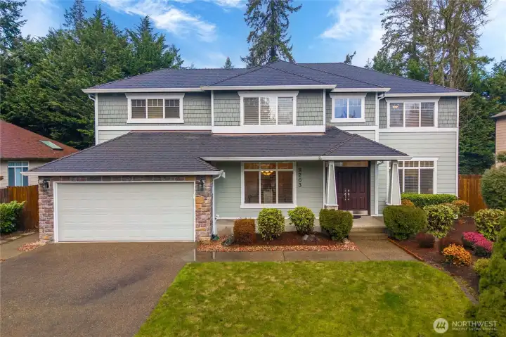 Classic architecture with timeless curb appeal. An inviting covered front porch welcomes guests in style.