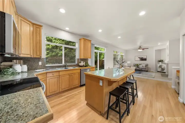 Center island provides prep space and a gathering point. Abundant cabinetry keeps everything organized.