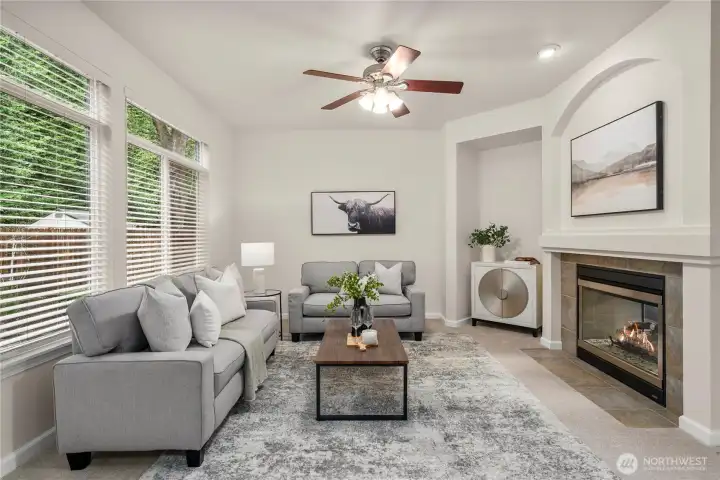 Comfortable family room designed for everyday living. Striking two-way fireplace adds warmth and ambiance.