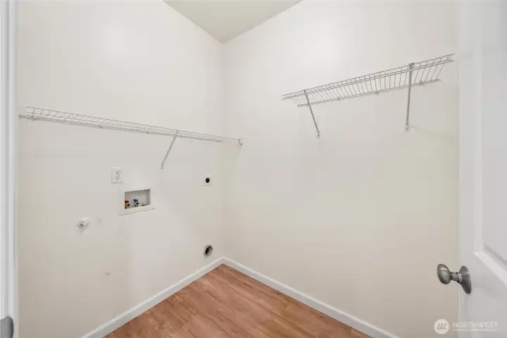 Laundry room with shelving.