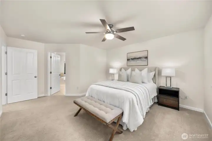 Private and serene primary bedroom with a private bath and walk-in closet.