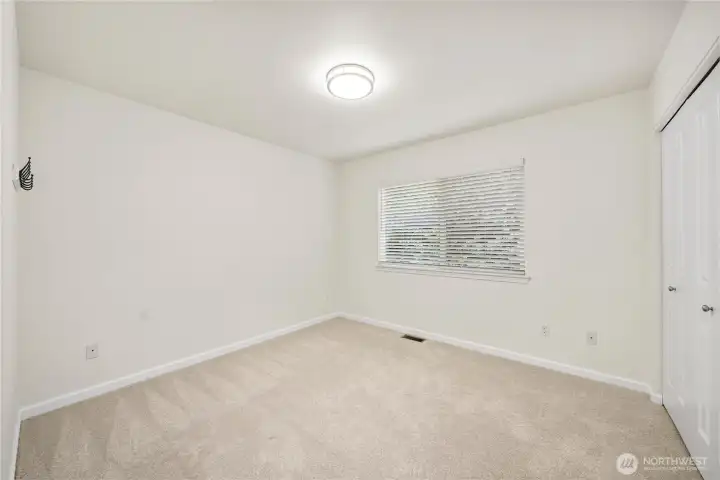 Additional bedroom offers flexibility and comfort.