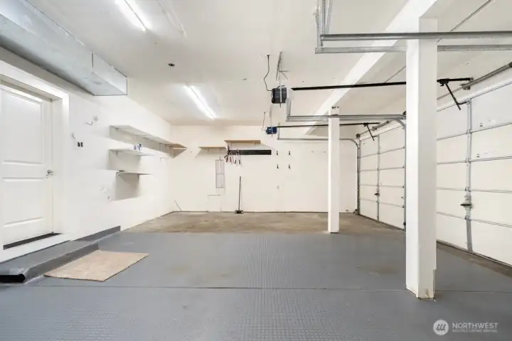 Huge 3 car garage with extra storage and plenty of space for a shop