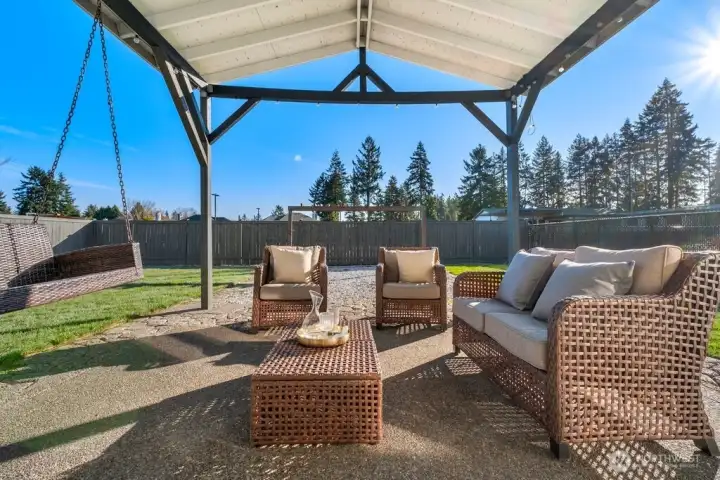 The covered outdoor living area is perfect for enjoying outdoors rain or shine!