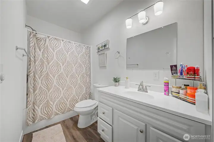 Step into a beautiful remodeled bathroom. sleek countertops, fresh finishes.