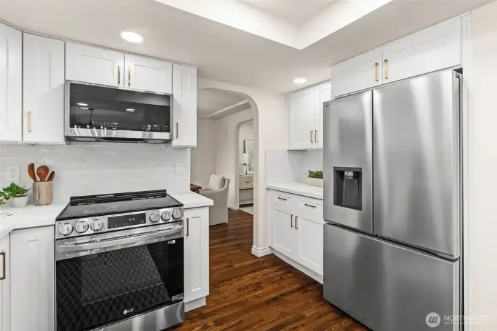 Designed for convenience, the kitchen offers excellent storage, preparation space, and easy access to adjacent living areas.