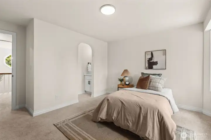 Bedroom includes a private vanity area and generous floor space for a variety of furniture arrangements.