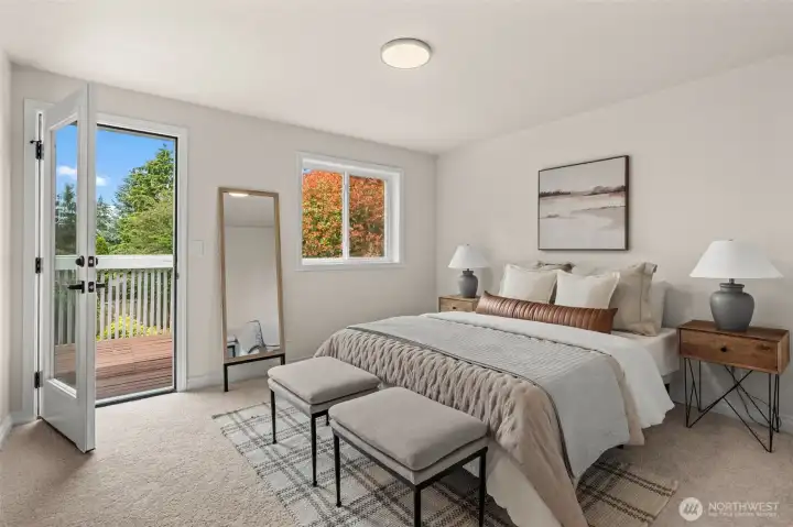 Primary bedroom offers a comfortable retreat with direct outdoor access and ample floor space.