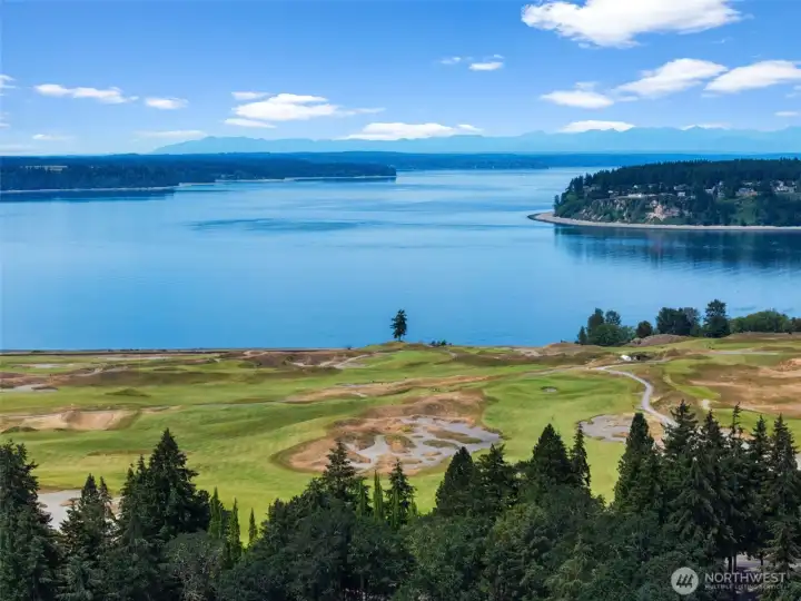 Aerial perspective showcasing the nearby Chambers Bay area and scenic coastal surroundings.