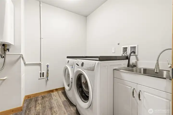 Laundry, On Demand Hot Water Tank and Utility Sink on the Lower Level