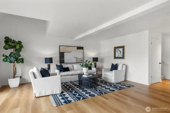 Beautiful newer engineered hardwoods flow throughout the living & dining areas.