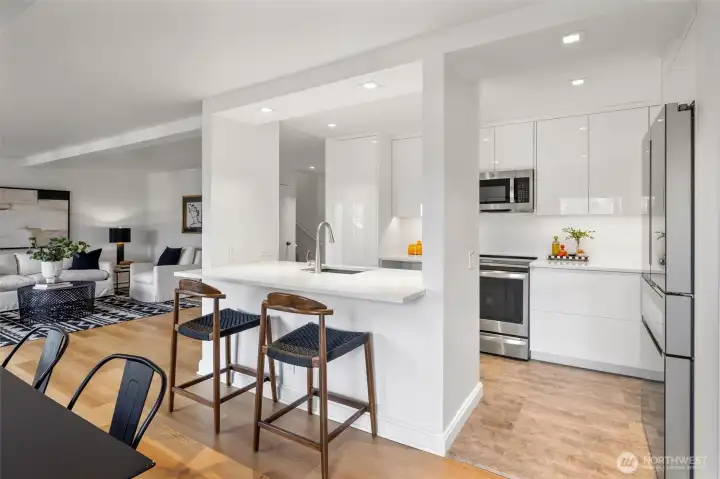 The living areas flow around an updated center-stage kitchen.
