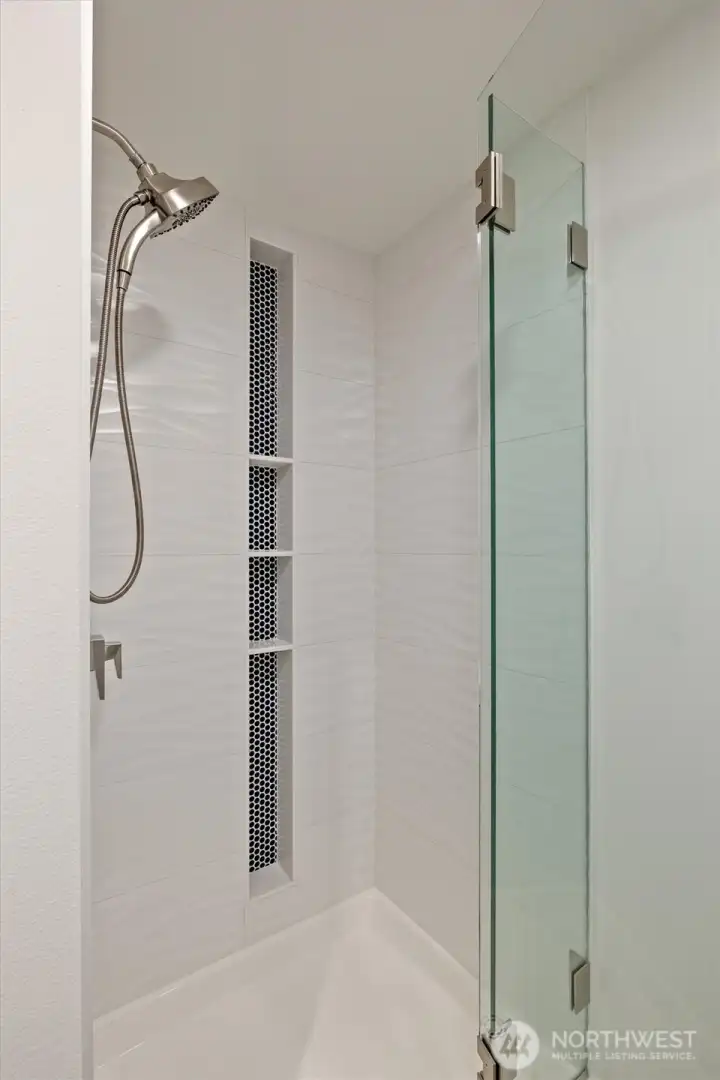 Stylish newer shower in the main floor bathroom.