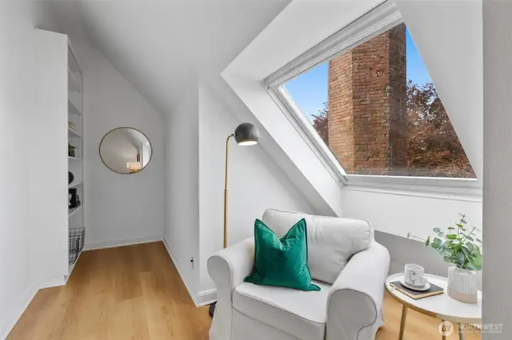 Cozy up to the windowed nook with built-in library shelving.