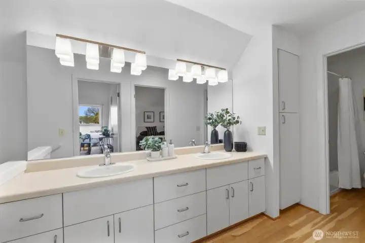 Dual sinks, ample storage, and a separate bath/shower/commode room.