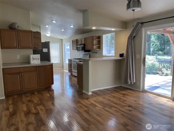 Open floor plan with slider leading to back deck