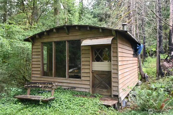 County says 288 sq ft cabin, built in 1956 ~ rough condition.  Estate selling property AS-IS.