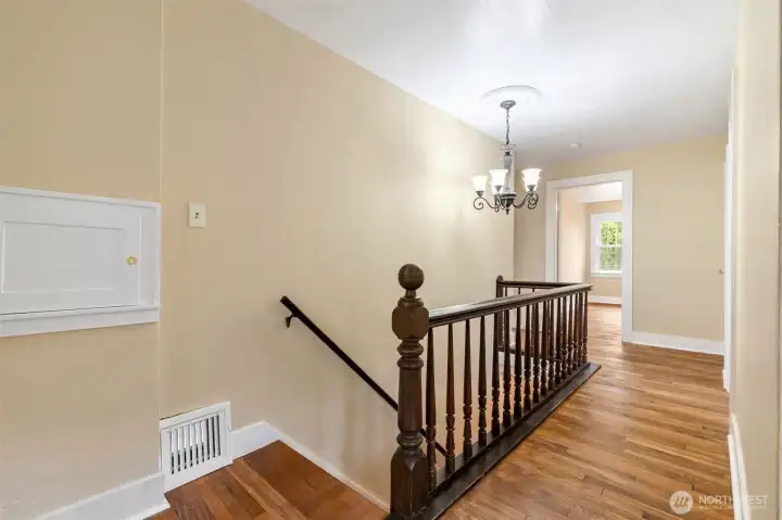 Upstairs landing with laundry chute to lower level laundry area. Upstairs landing with laundry chute to lower level laundry area.